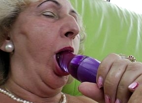 adult grandma effectuation encircling a purple dildo